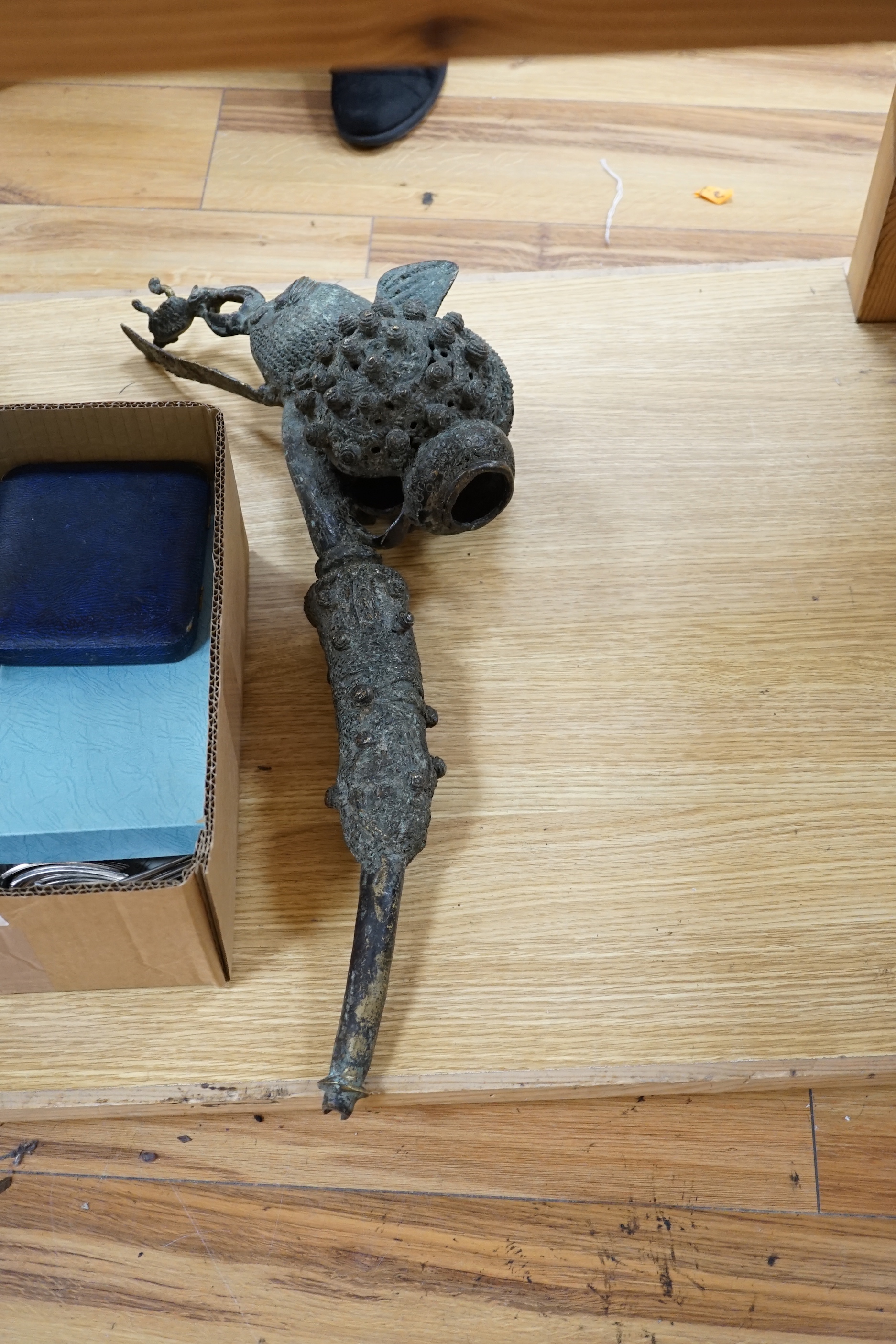 Two Bamoun bronze and bone pipes, another larger, and two figures, largest item 60cms long